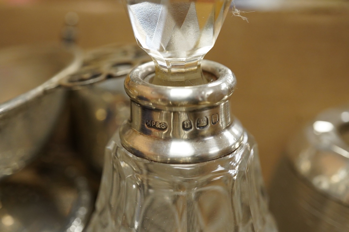 A George V pierced silver three piece condiment set, James Dixon & Sons, Sheffield, 1923/25, together with seven other assorted silver condiments, a silver mounted trinket box, a silver egg cup, a silver mounted glass sa